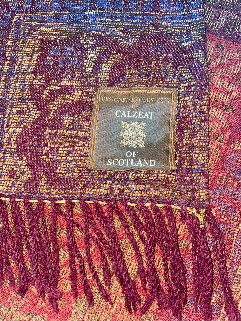 CALZEAT OF SCOTLAND Red and Gold Woven Fringe Throw Blanket.